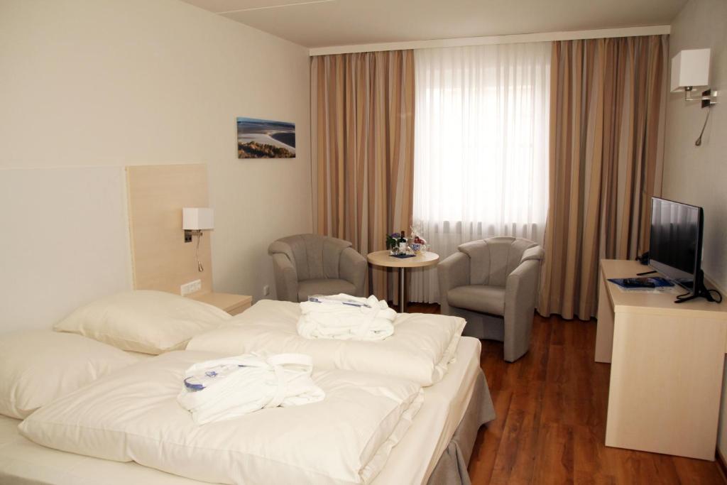 Postel nebo postele na pokoji v ubytování Hotel Deutscher Kaiser