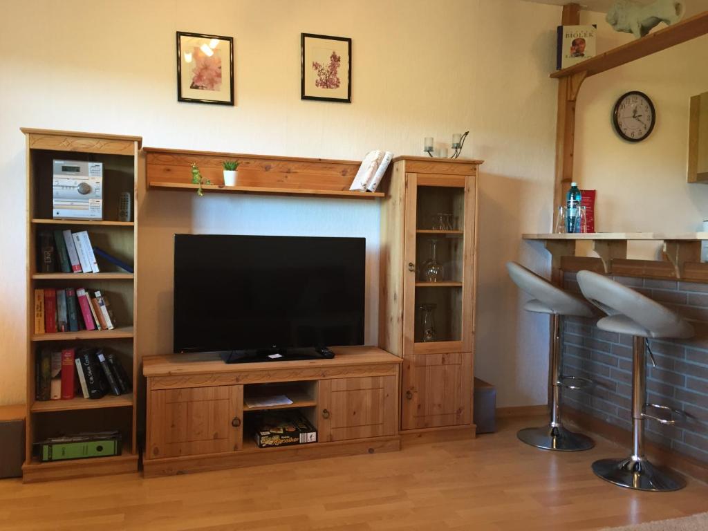 a large entertainment center with a flat screen tv at FeWo Lahnblick in Löhnberg