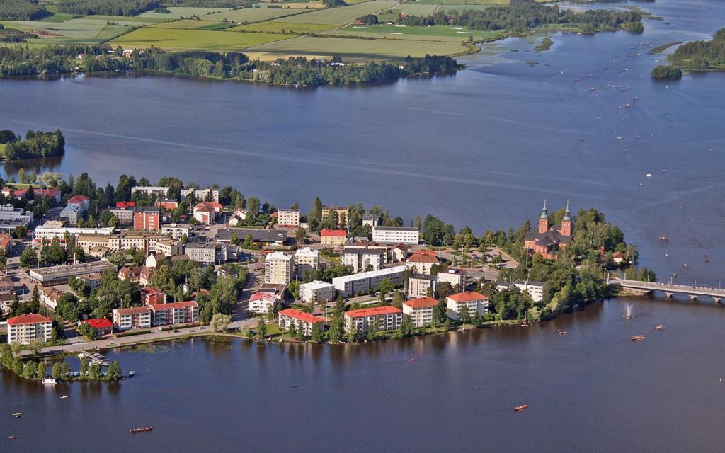 an aerial view of a small town on a lake at Vammalan Seurahuone in Sastamala