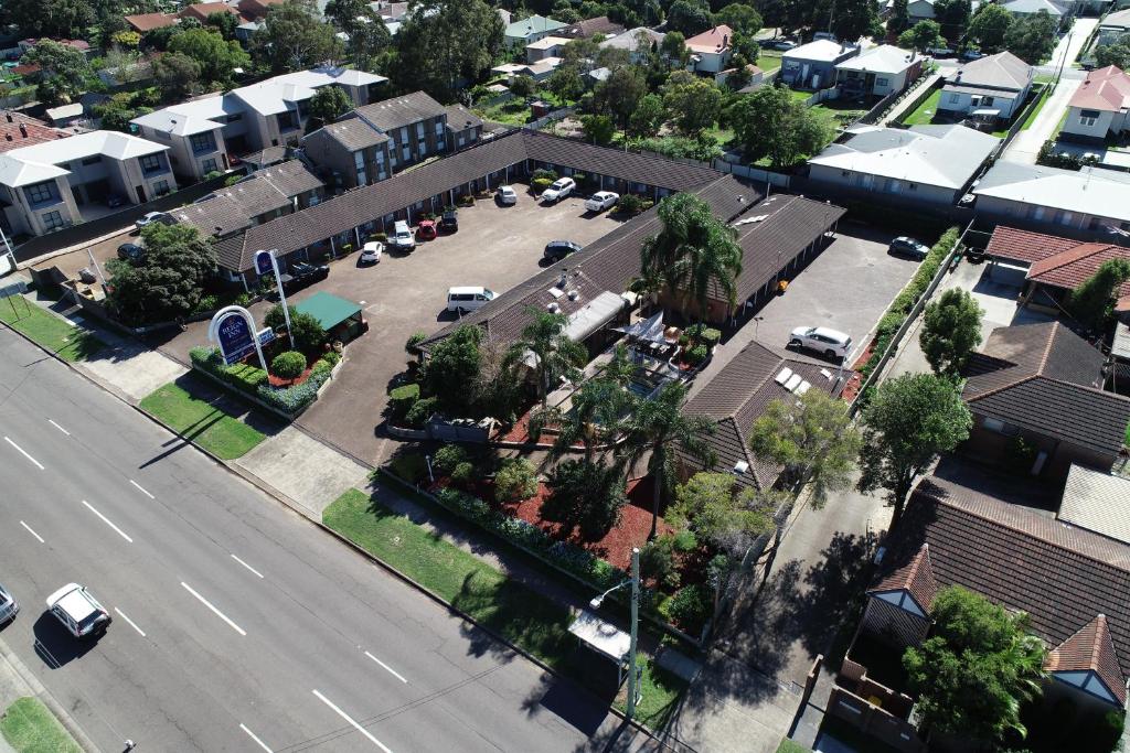 an aerial view of a street in a small town at Reign Inn Newcastle in Newcastle