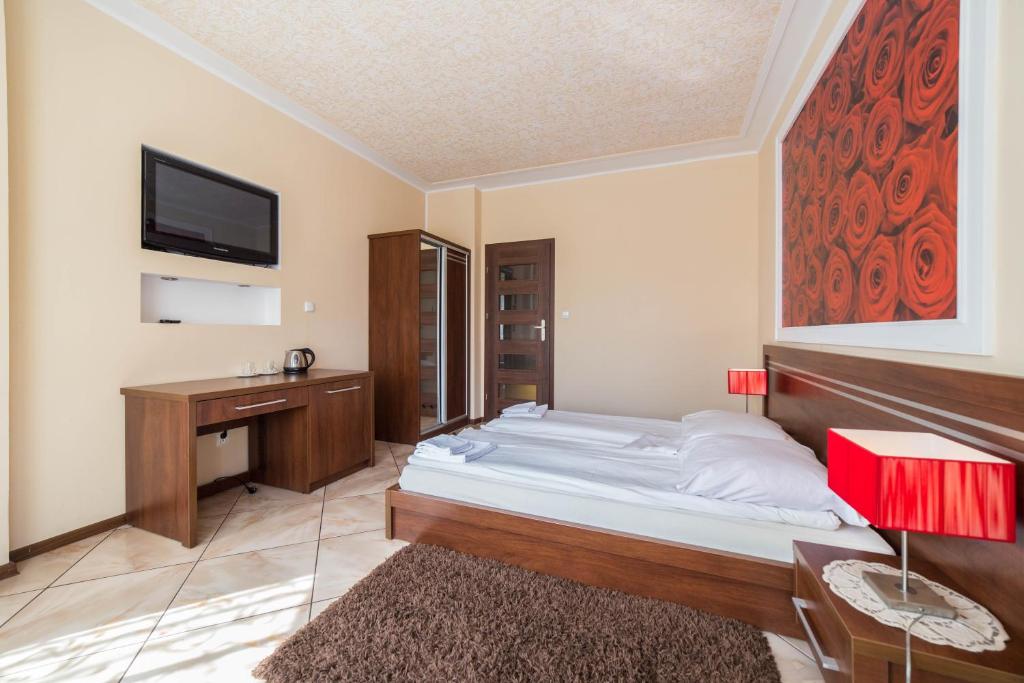 Łóżko lub łóżka w pokoju w obiekcie Malwa