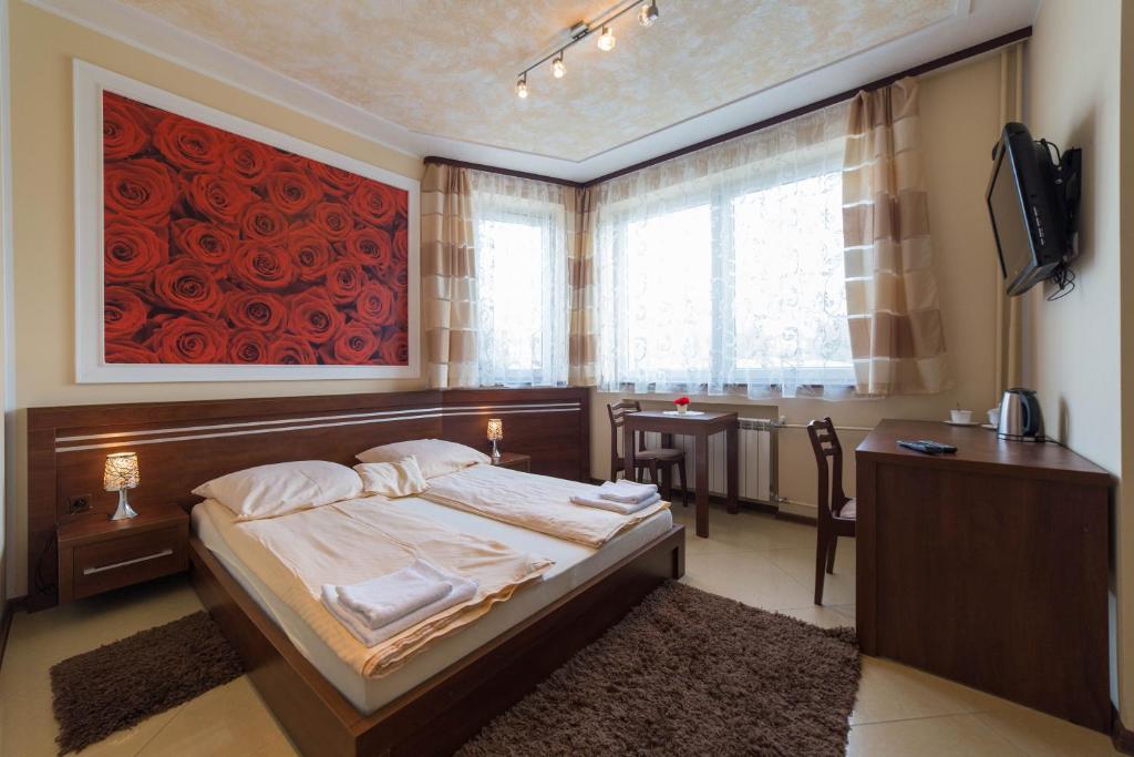 Łóżko lub łóżka w pokoju w obiekcie Malwa