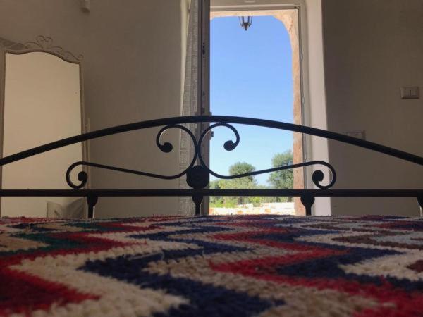 Postel nebo postele na pokoji v ubytování Trulli da Lalli