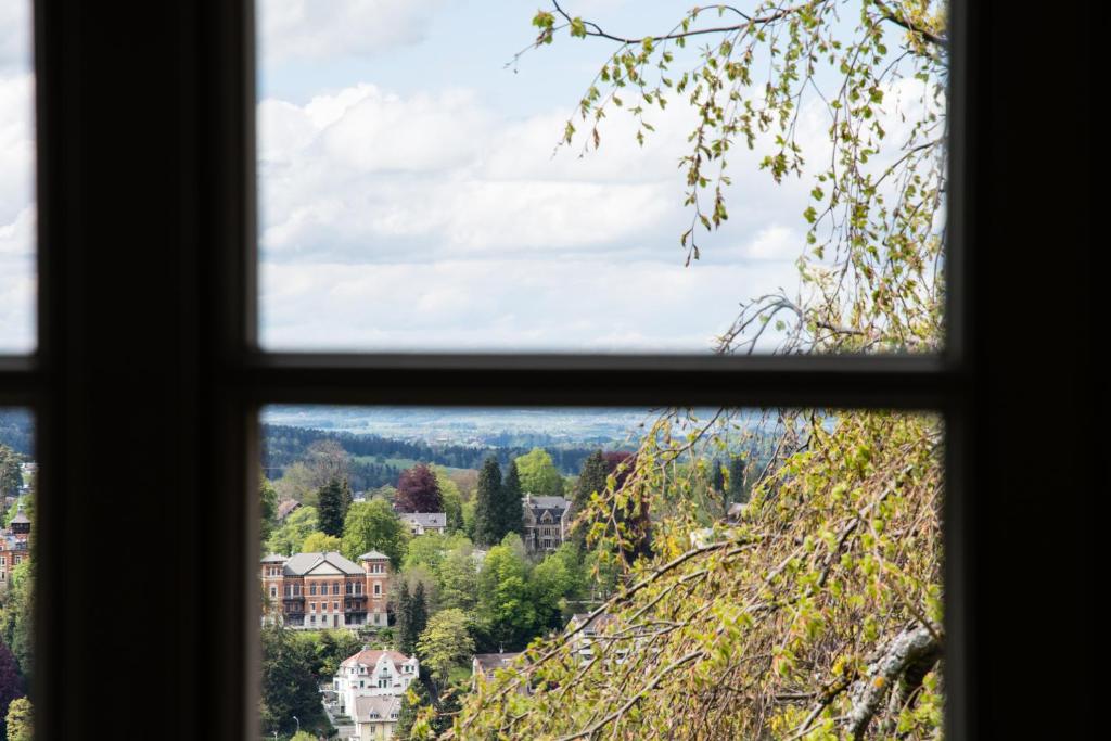 a view from a window of a town at Hotel Restaurant Falkenburg in St. Gallen