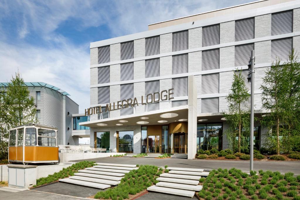 a rendering of the front of the hotel american lodge at Hotel Allegra Lodge in Kloten