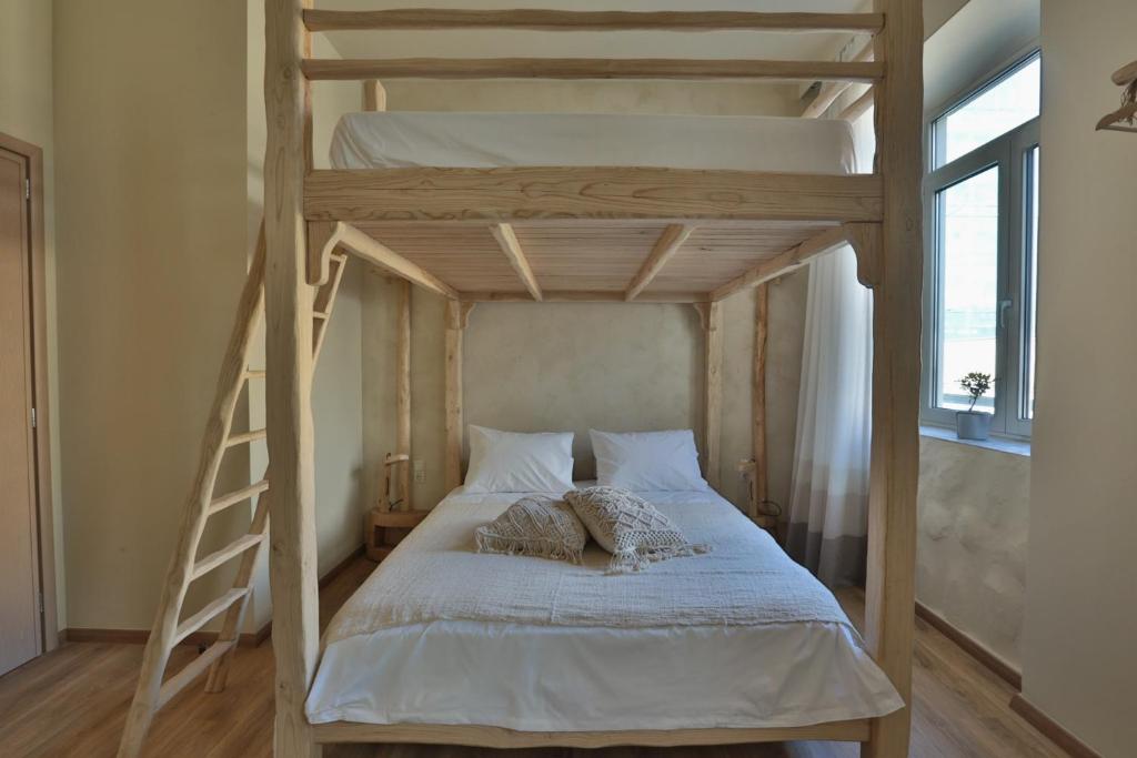 Postel nebo postele na pokoji v ubytování Ederlezi Boutique Hotel