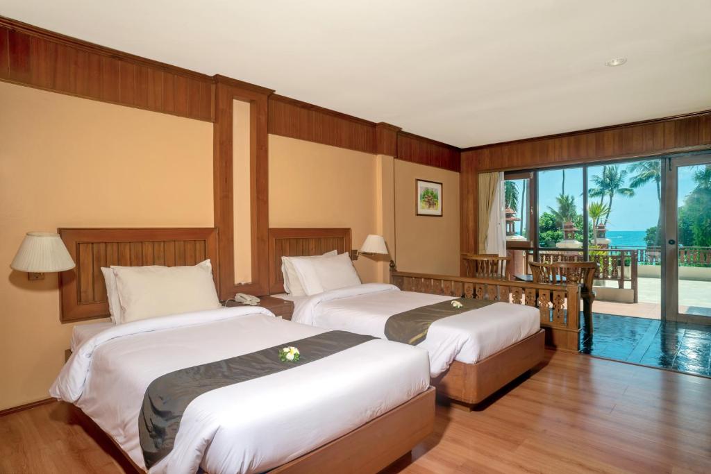 Postel nebo postele na pokoji v ubytování Aloha Resort