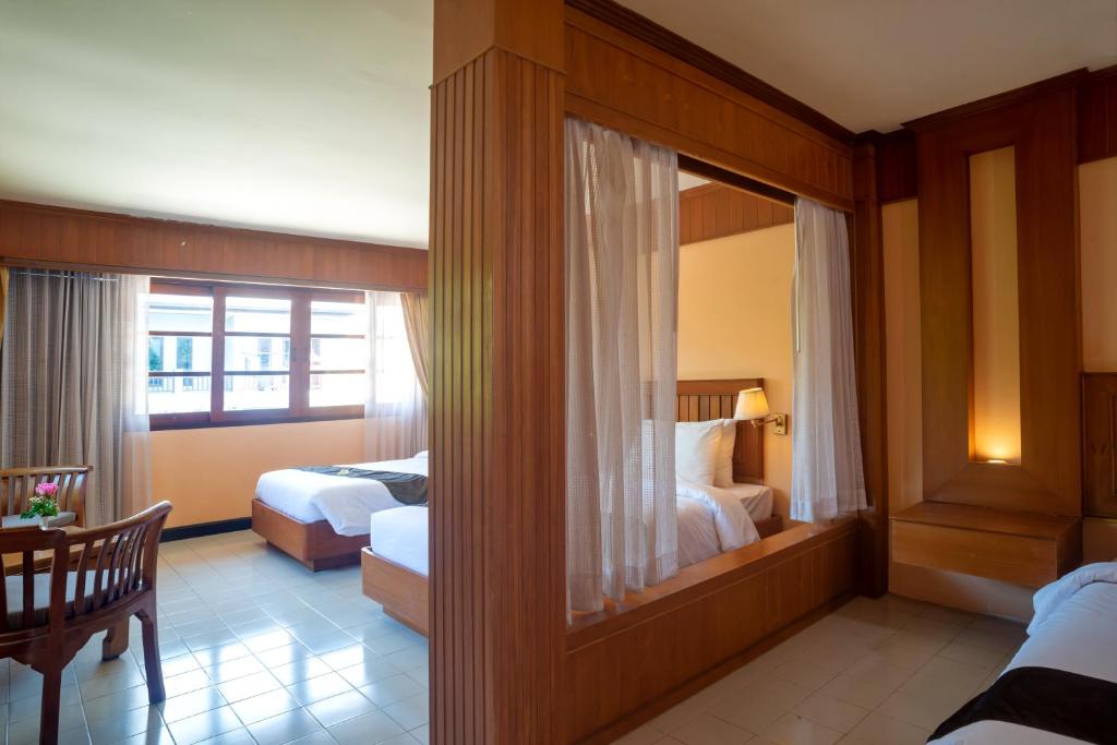 Postel nebo postele na pokoji v ubytování Aloha Resort