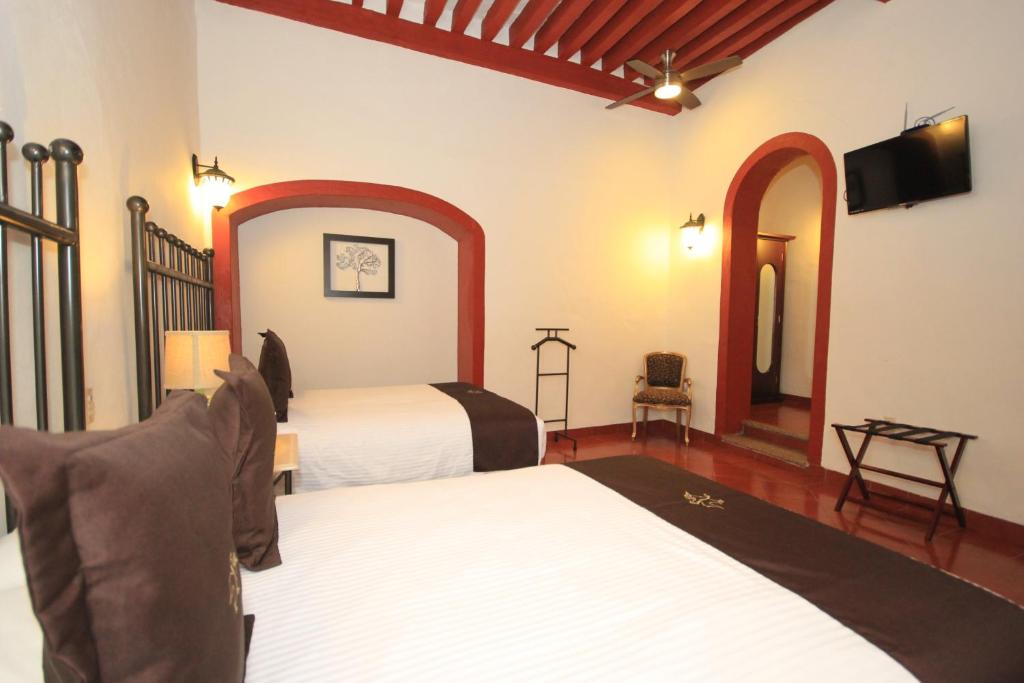 Postel nebo postele na pokoji v ubytování Hotel Santa Regina