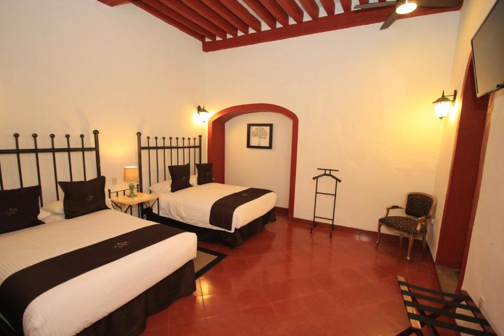 Postel nebo postele na pokoji v ubytování Hotel Santa Regina
