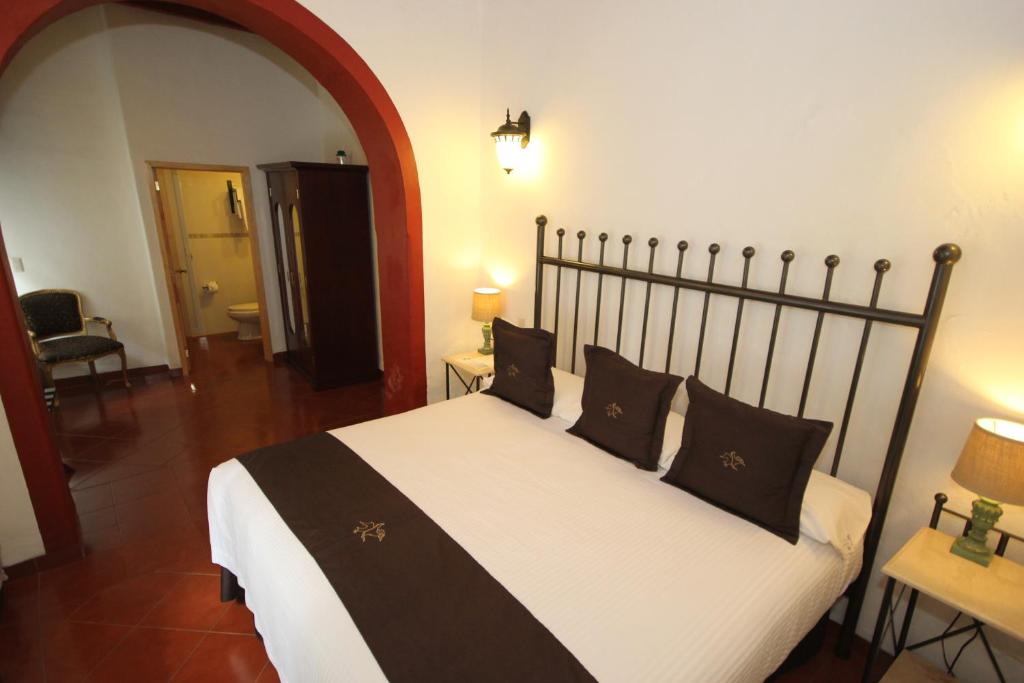 Postel nebo postele na pokoji v ubytování Hotel Santa Regina