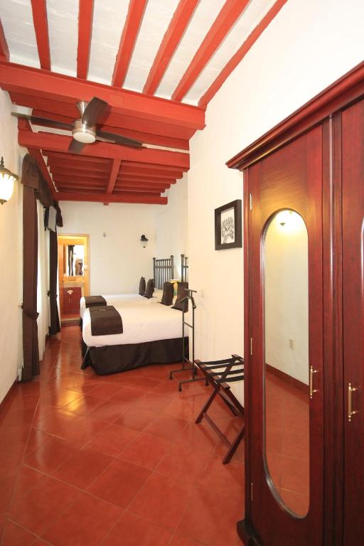 Postel nebo postele na pokoji v ubytování Hotel Santa Regina