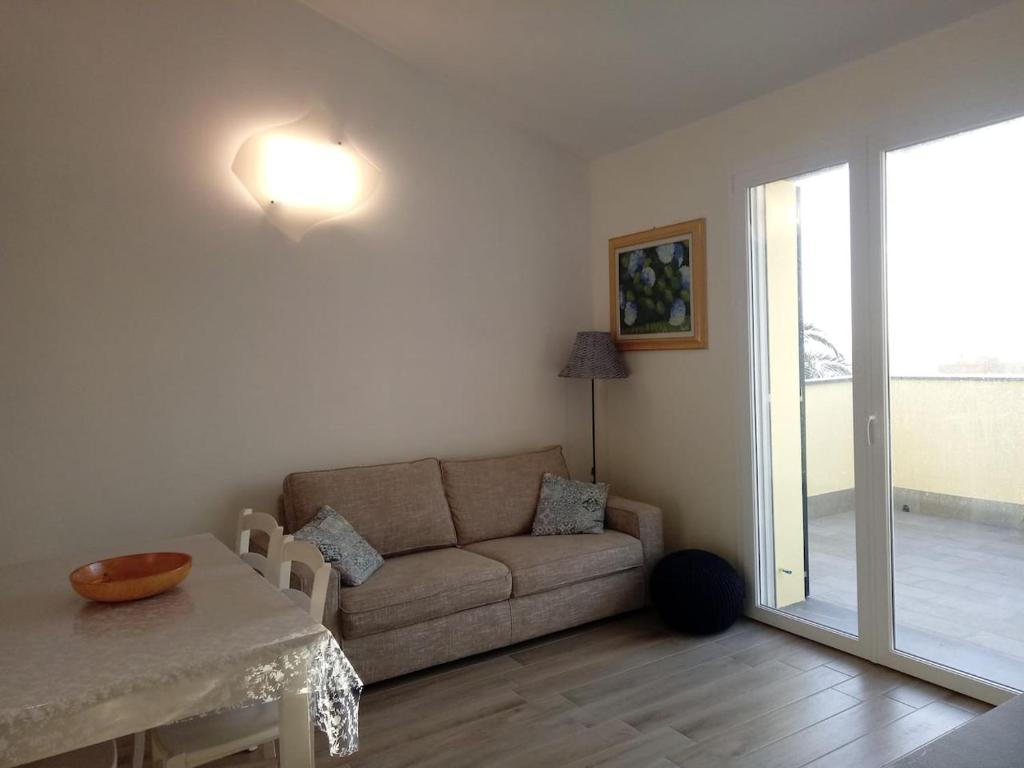 Posedenie v ubytovaní Appartamento Leccino con piscina - Riva Trigoso