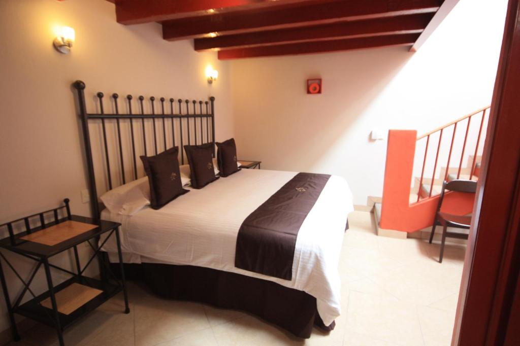 Postel nebo postele na pokoji v ubytování Hotel Santa Regina