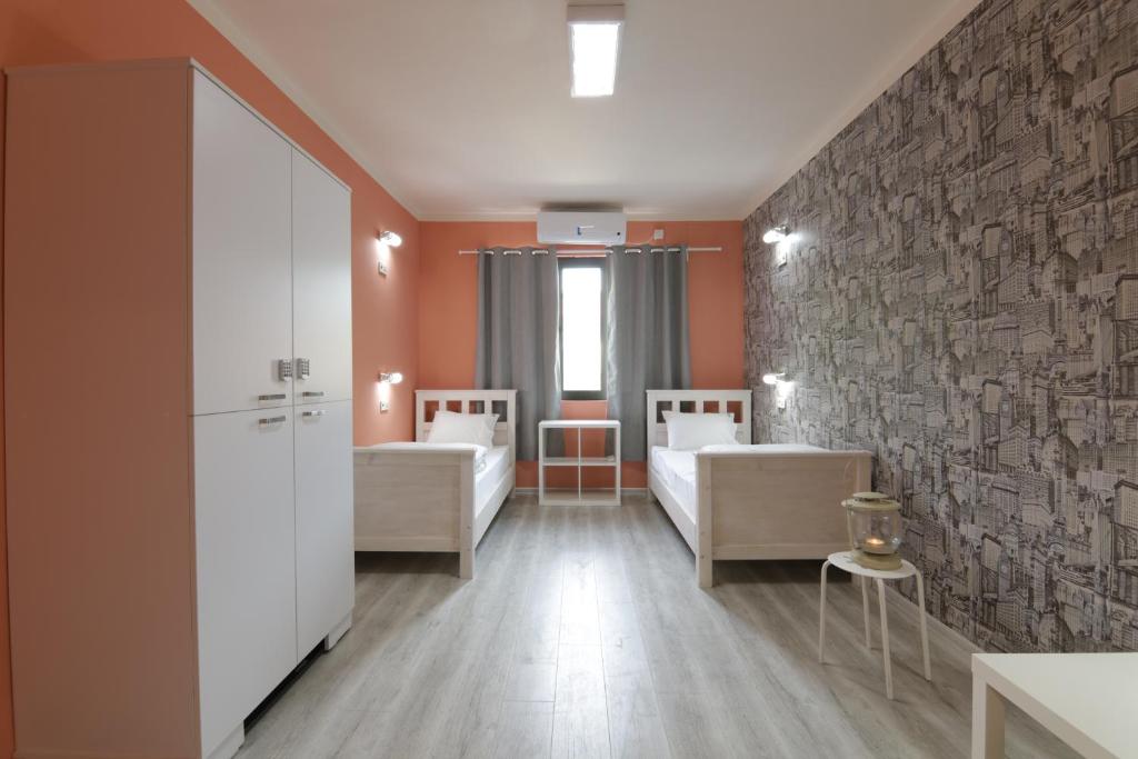 Postel nebo postele na pokoji v ubytování Hostel Kyosheto