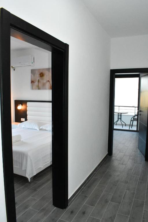 Postel nebo postele na pokoji v ubytování Flo Apartments