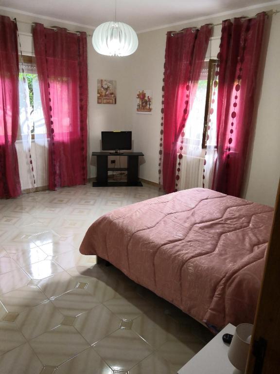 Posteľ alebo postele v izbe v ubytovaní Case vacanze LE ROSE