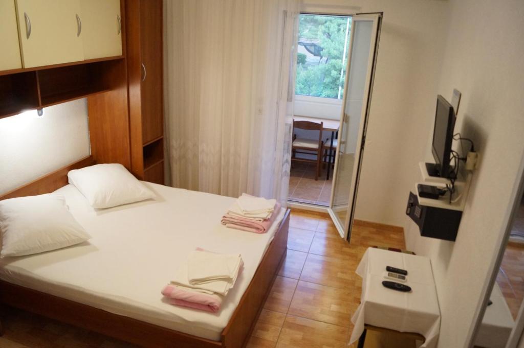 Postel nebo postele na pokoji v ubytování Apartments Mario with private parking