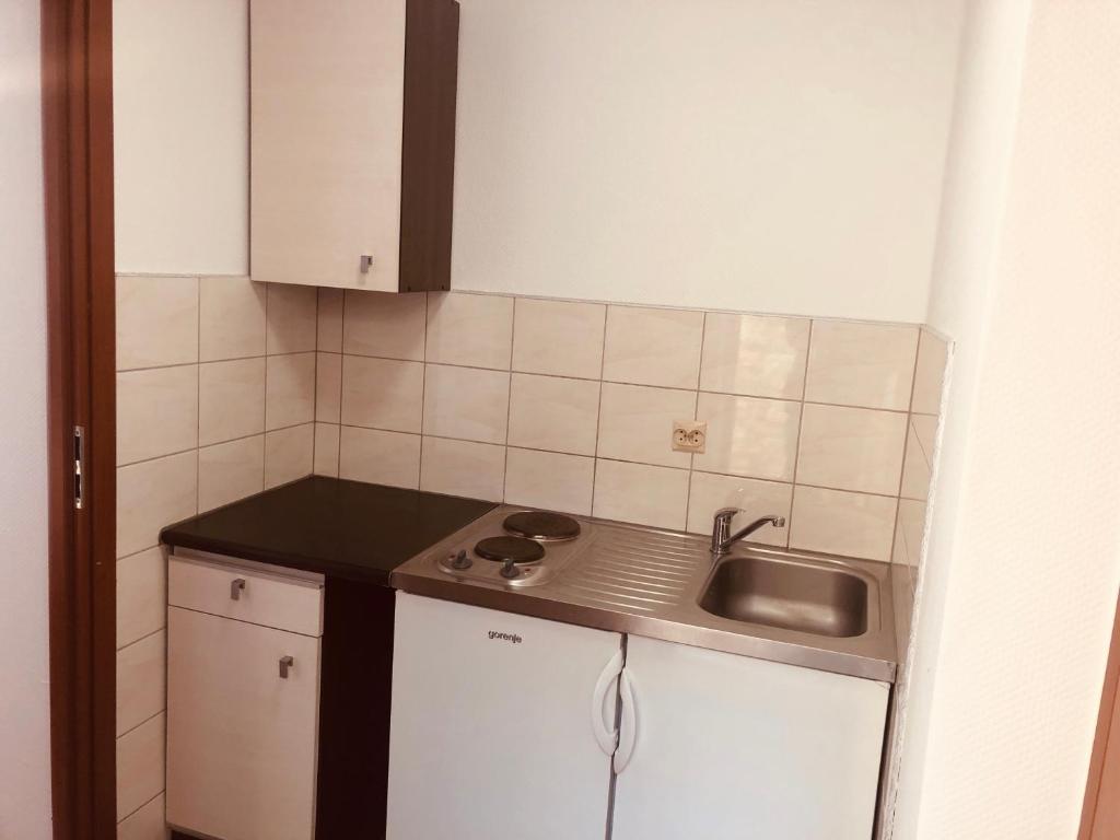Kuchyňa alebo kuchynka v ubytovaní Pod Winnym Gronem