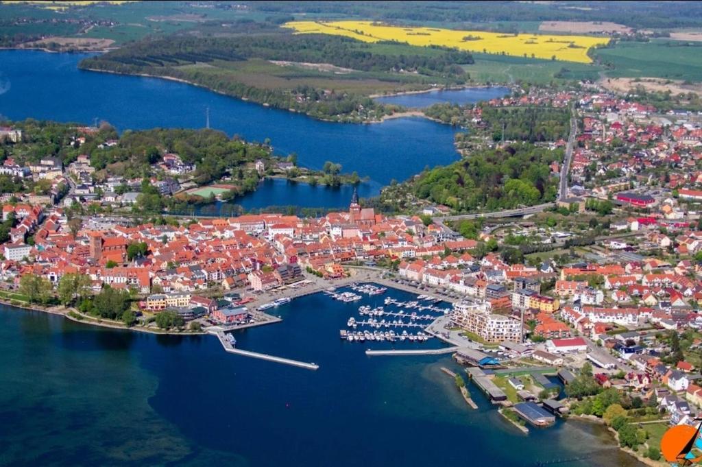 an aerial view of a small town on a lake at Unterkunft Müritz in Waren