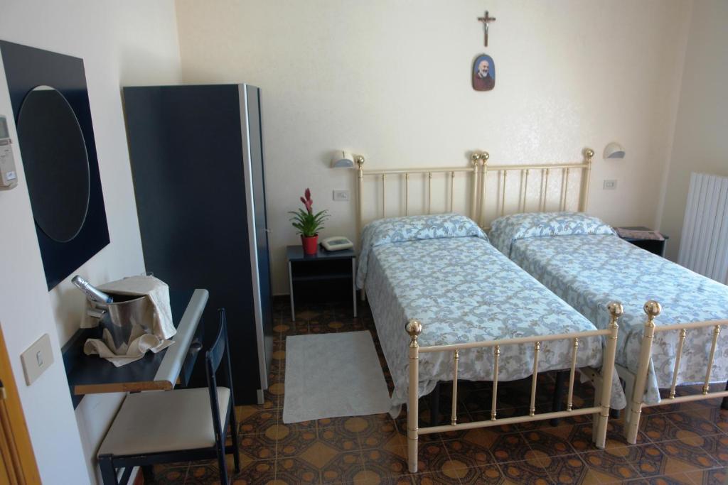 Postel nebo postele na pokoji v ubytování Hotel Gaggiano