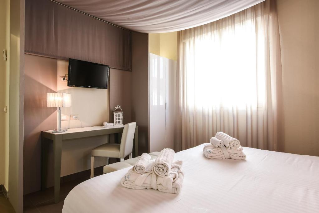 Postel nebo postele na pokoji v ubytování Park Hotel Morigi Garden & Spa