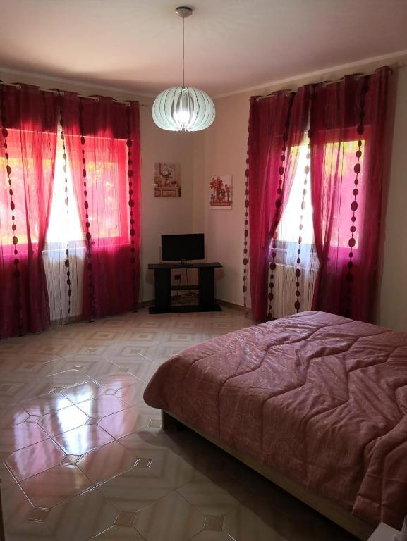 Posteľ alebo postele v izbe v ubytovaní Case vacanze LE ROSE