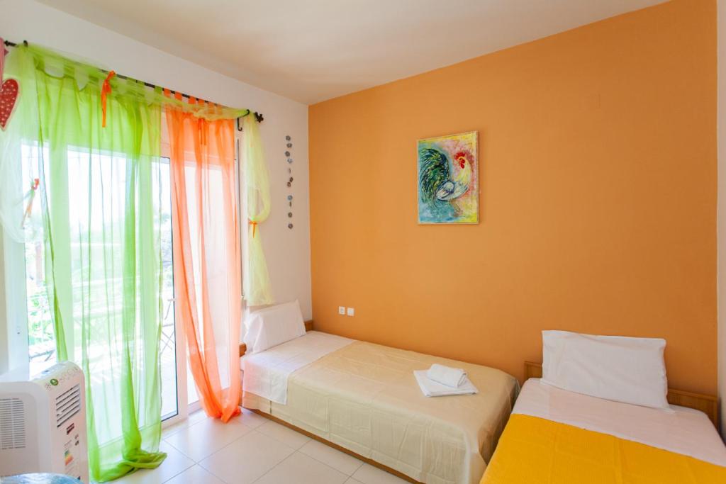 A bed or beds in a room at Cretamos Seaside Villas