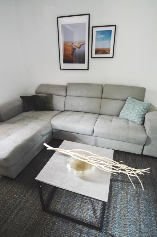 a living room with a couch and a coffee table at Apartments Lucija in Zadar