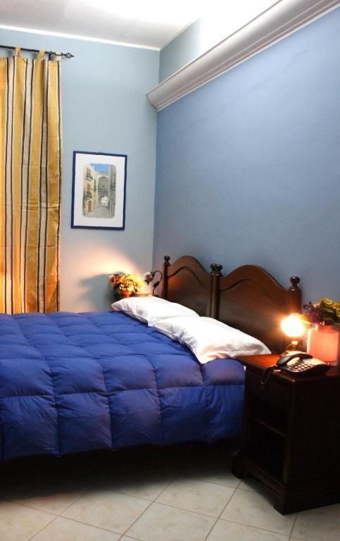 Posteľ alebo postele v izbe v ubytovaní Hotel Piro