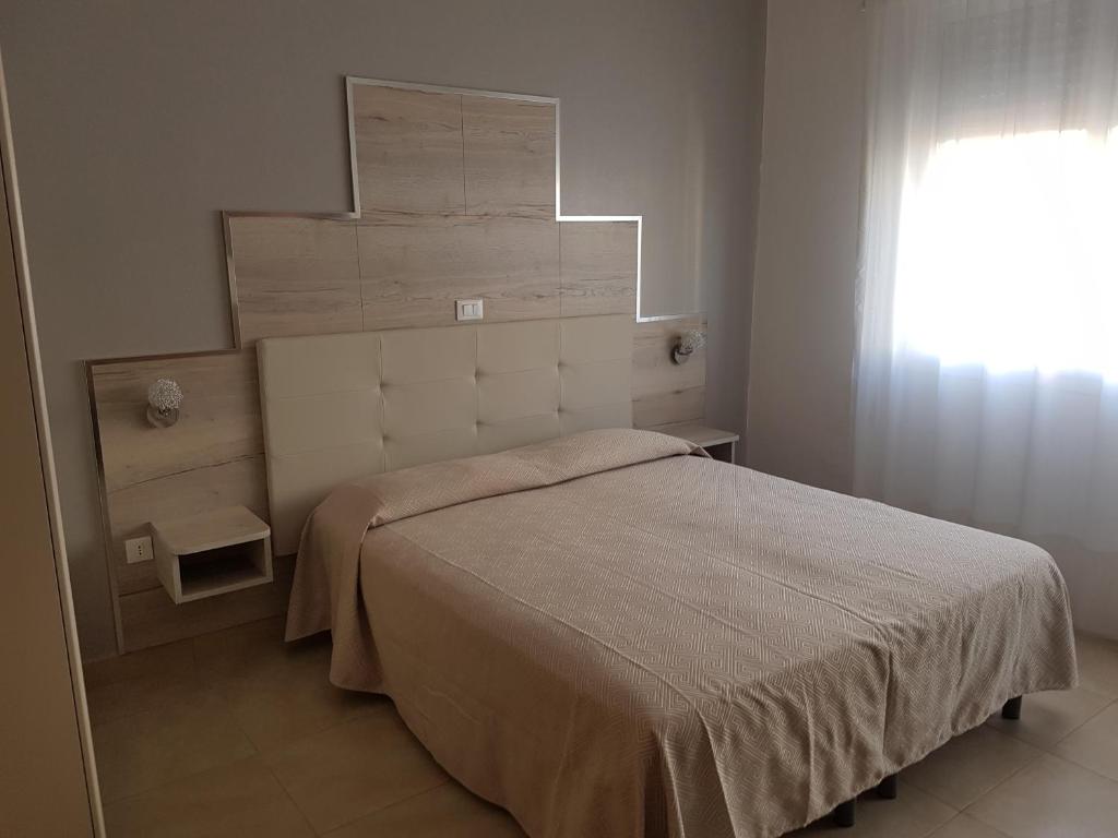 Voodi või voodid majutusasutuse Albergo Paris toas