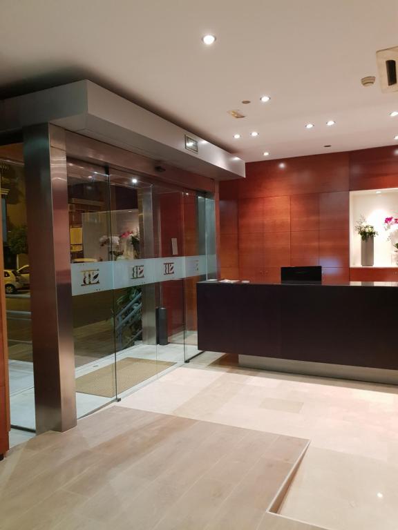 a lobby with a reception desk in a building at Sant bonifaci petrer in Elda