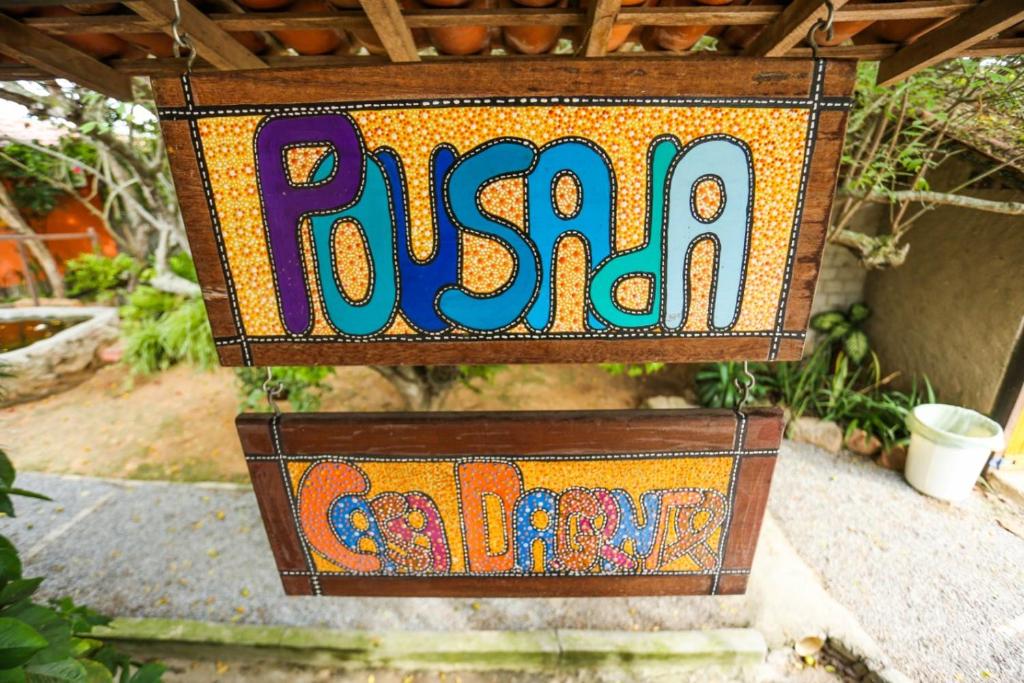 a wooden box with a sign that says russianarma at Pousada Casa da Gente in Caruaru