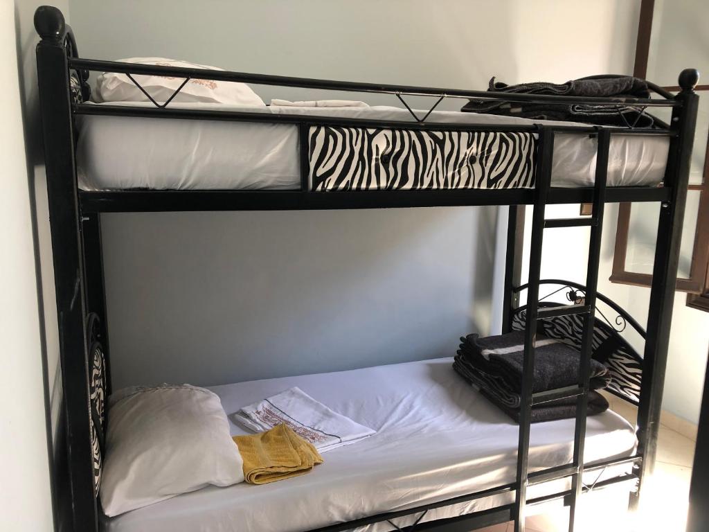 Una cama o camas en una habitación de TanjaLucia Hostel