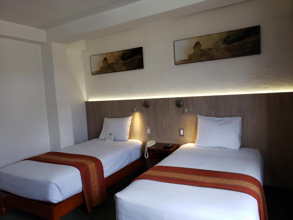 Postel nebo postele na pokoji v ubytování Hotel Sueños del Inka