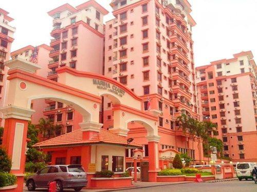 a building in a city with tall buildings at North Borneo Paradise@Marina Court in Kota Kinabalu