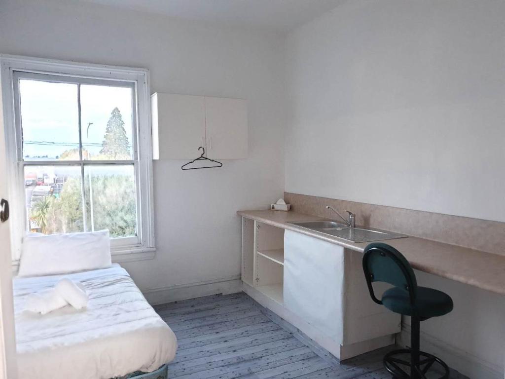 Postel nebo postele na pokoji v ubytování South Rakaia Hotel