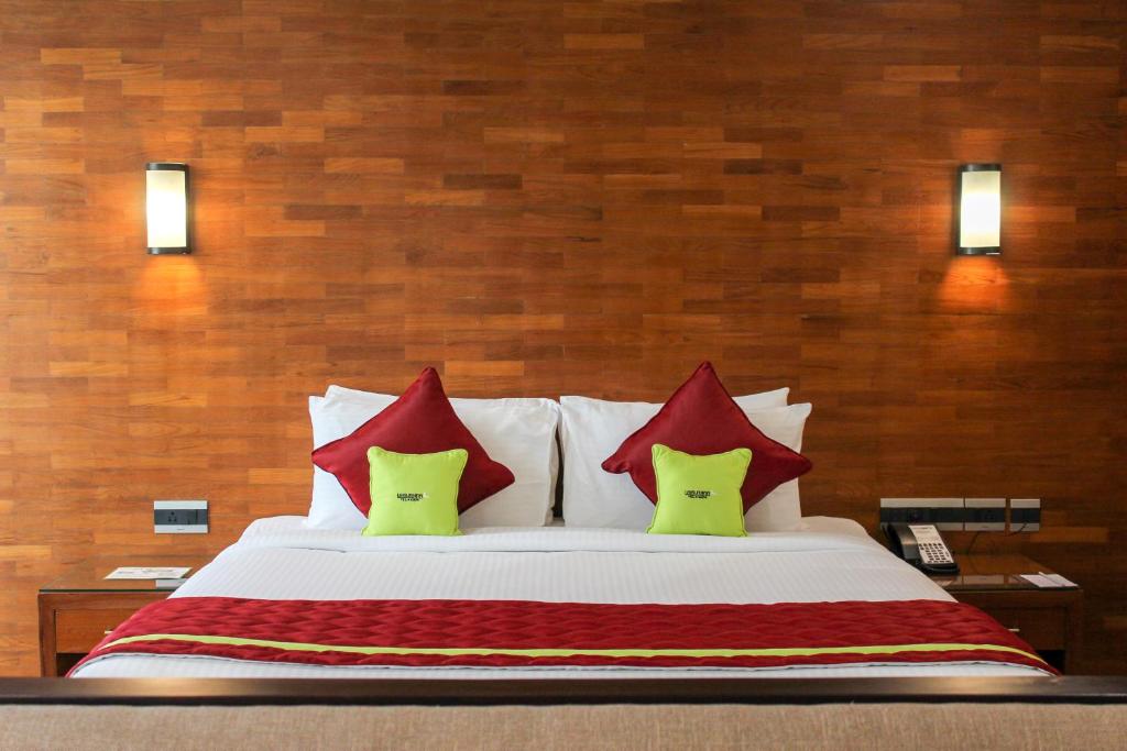 Postel nebo postele na pokoji v ubytování JVK Park Hotel