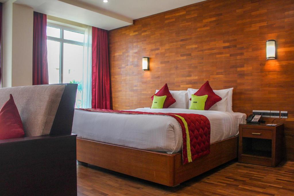 Postel nebo postele na pokoji v ubytování JVK Park Hotel