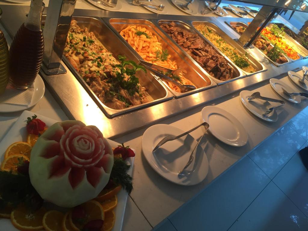 a buffet line with many different types of food at Corfu Hotel in Ayia Napa