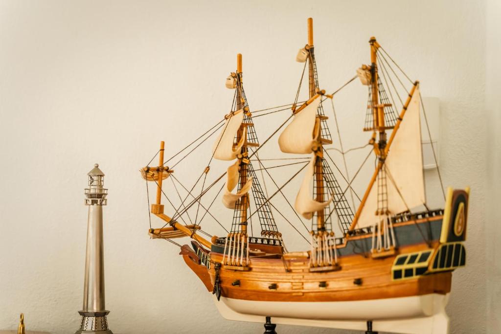 a model of a wooden ship on display at Theaktis Homes in Kaloi Limenes