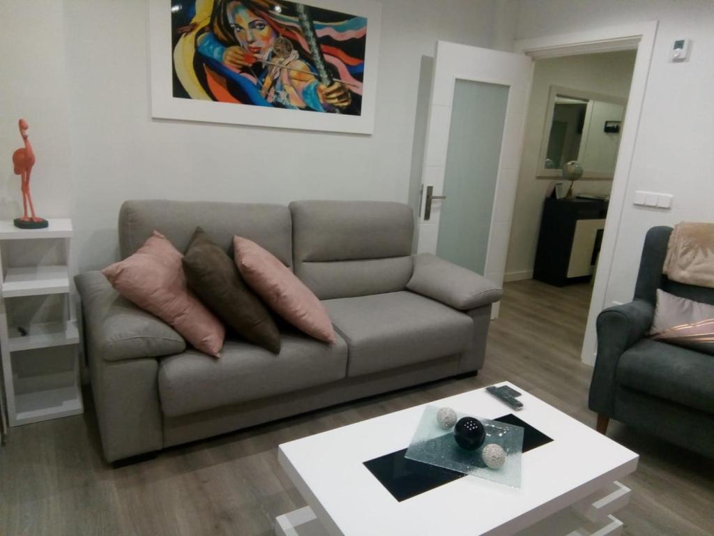 a living room with a couch and a table at VIVE CENTRO ASTORGA in Astorga