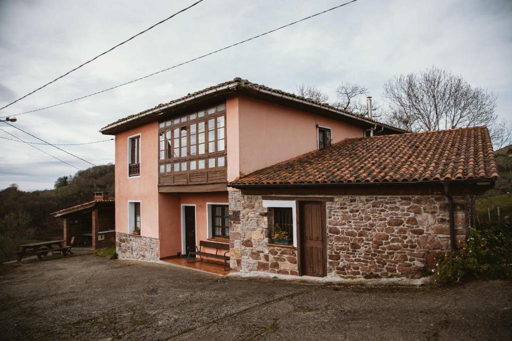 a small brick house with at Carquera Casa a 8 Km de Nava in Nava