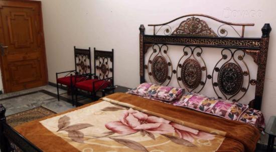 Postel nebo postele na pokoji v ubytování UK Lodge