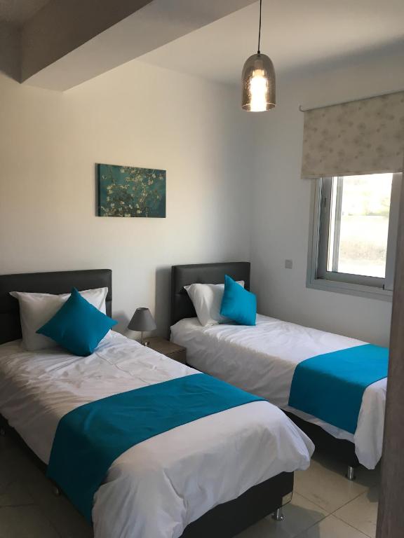 Postel nebo postele na pokoji v ubytování Elite Sea View Villa