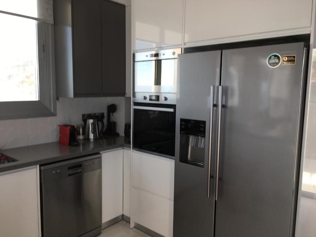 Kuchyň nebo kuchyňský kout v ubytování Elite Sea View Villa