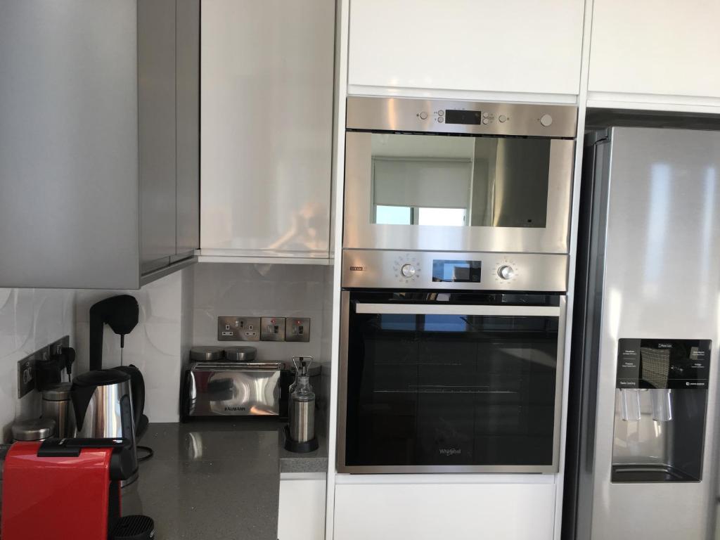 Kuchyň nebo kuchyňský kout v ubytování Elite Sea View Villa