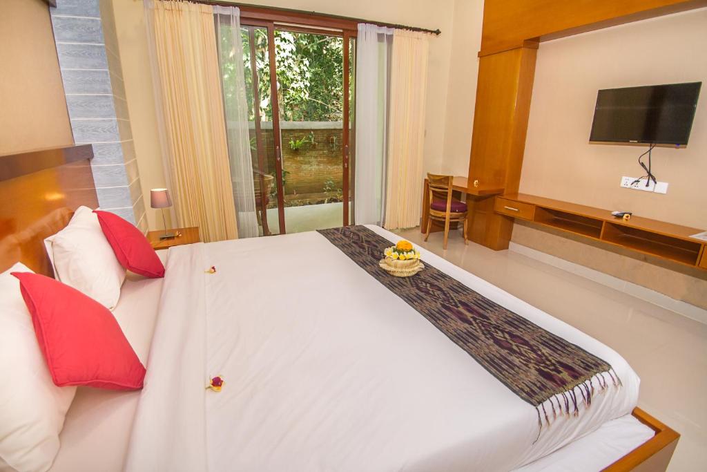 Postel nebo postele na pokoji v ubytování Adi Jaya Cottages Ubud Suites by EPS - CHSE Certified