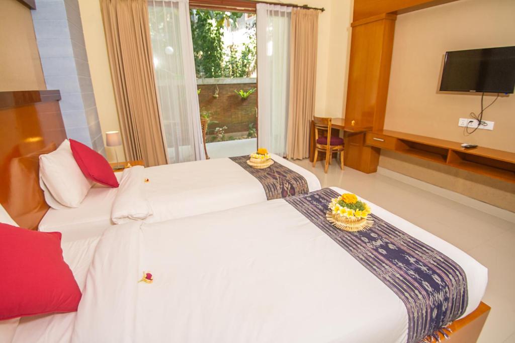 Postel nebo postele na pokoji v ubytování Adi Jaya Cottages Ubud Suites by EPS - CHSE Certified