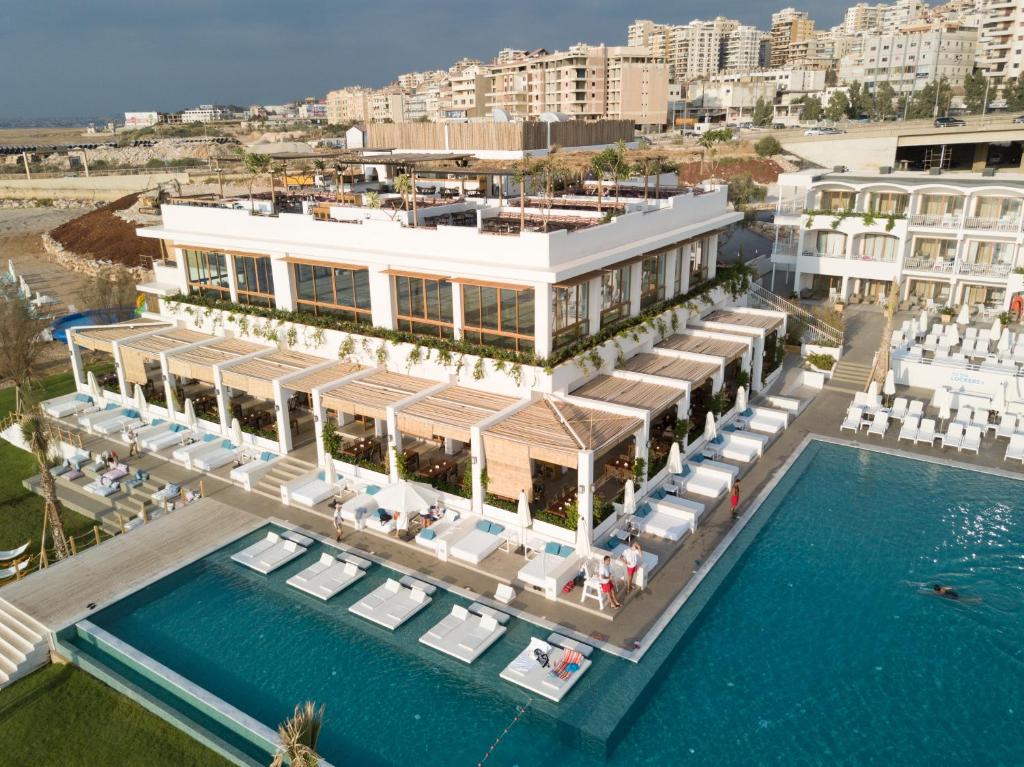 an aerial view of a resort with a pool at La Siesta Hotel & Beach Resort in Khaldah